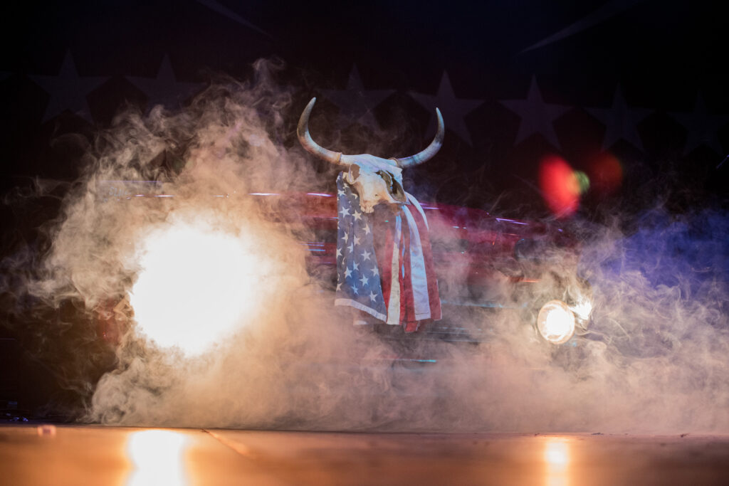 Chevy car with an animal skull and American flag