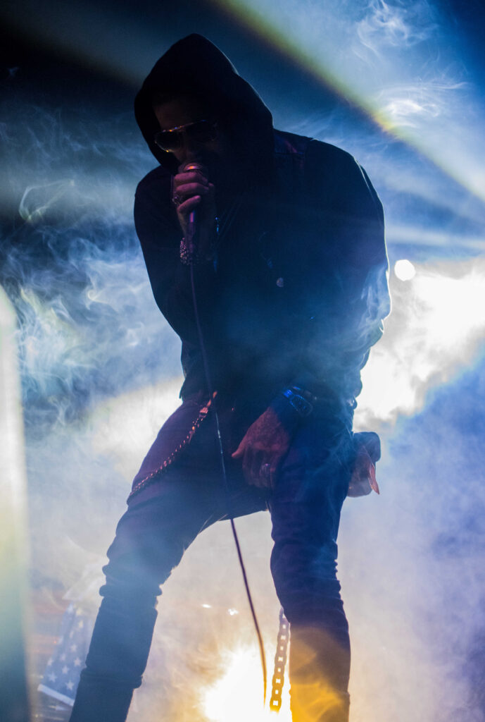 Yelawolf singing into a microphone