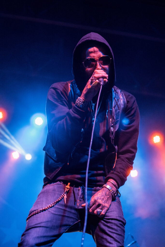 Yelawolf singing into a microphone