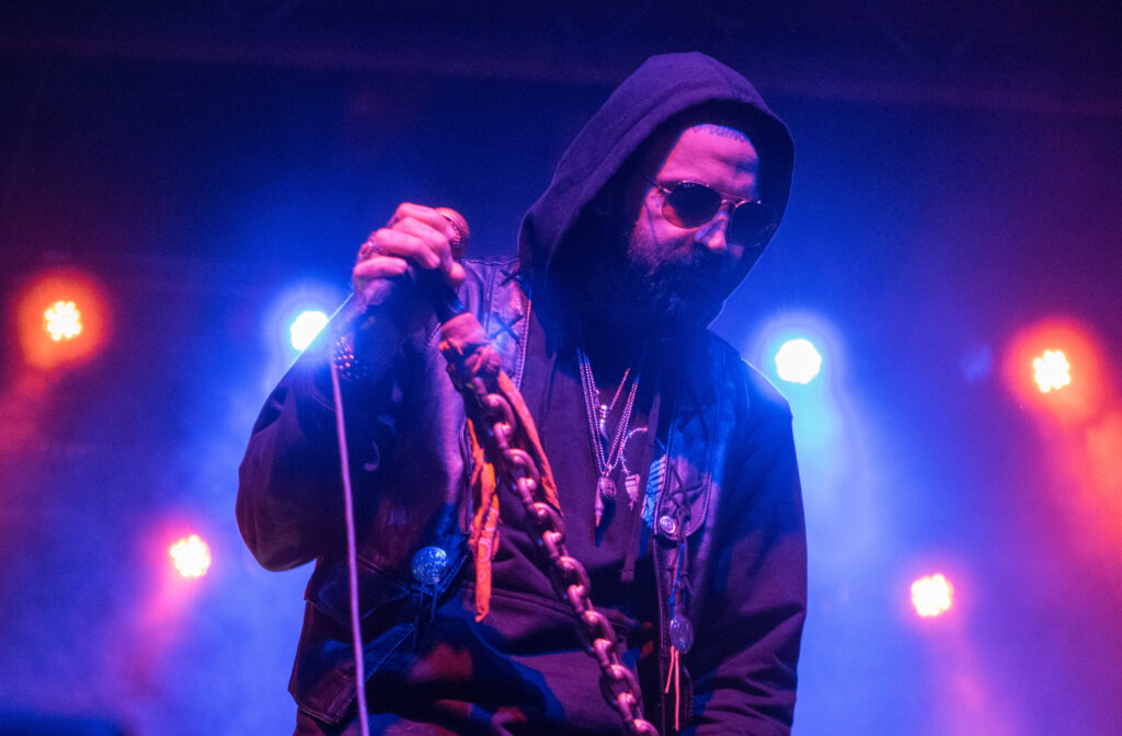 Yelawolf holding a microphone