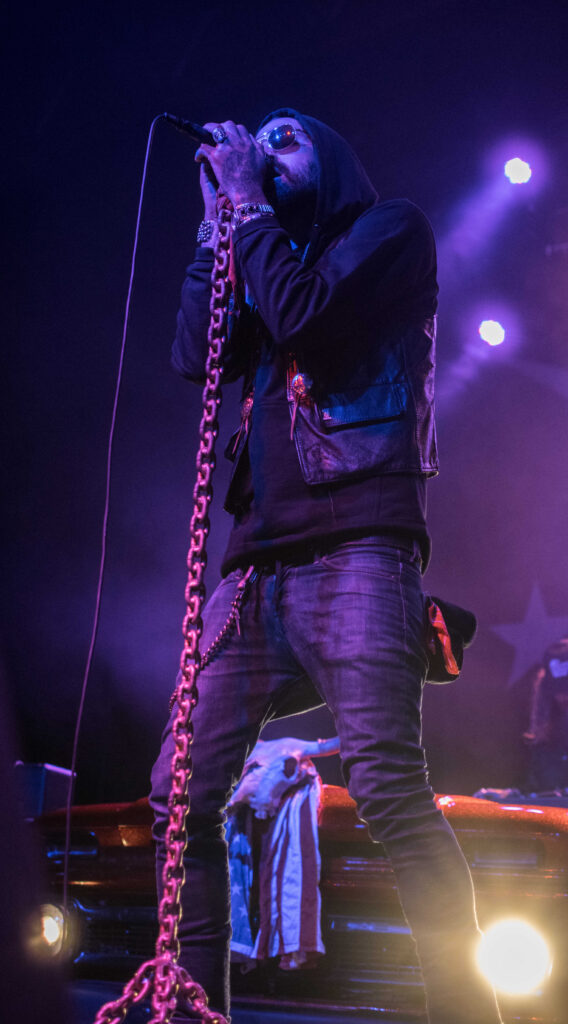 Yelawolf singing into a microphone