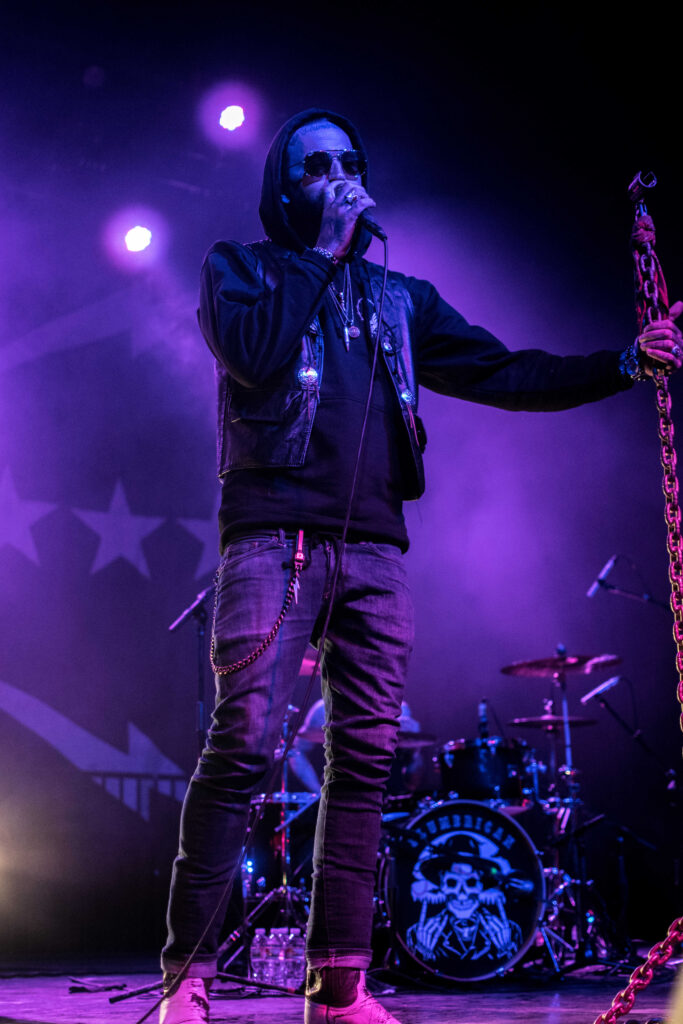 Yelawolf talking into a microphone