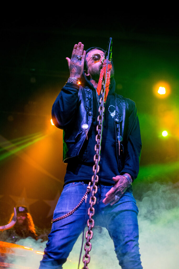 Yelawolf singing into a microphone