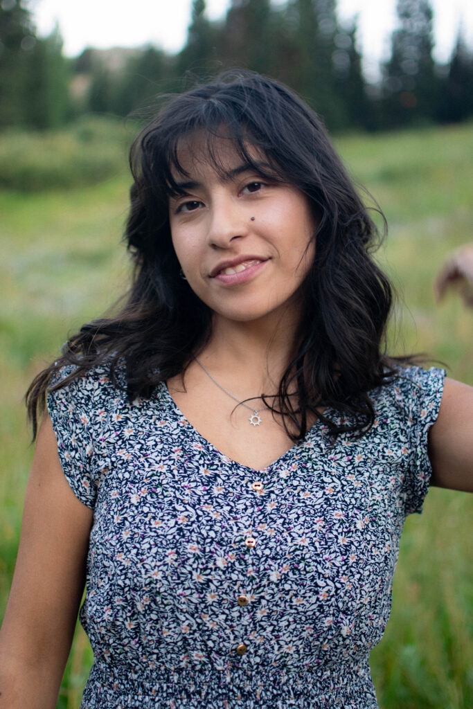 A woman smiling in a field