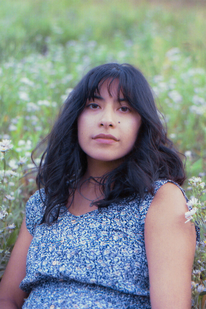 Film photo of a woman in wildflowers