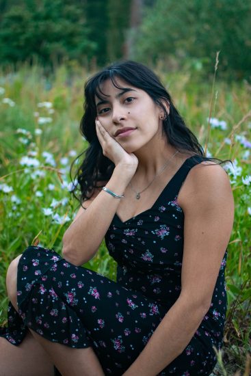 A woman in wildflowers at Albion Basin